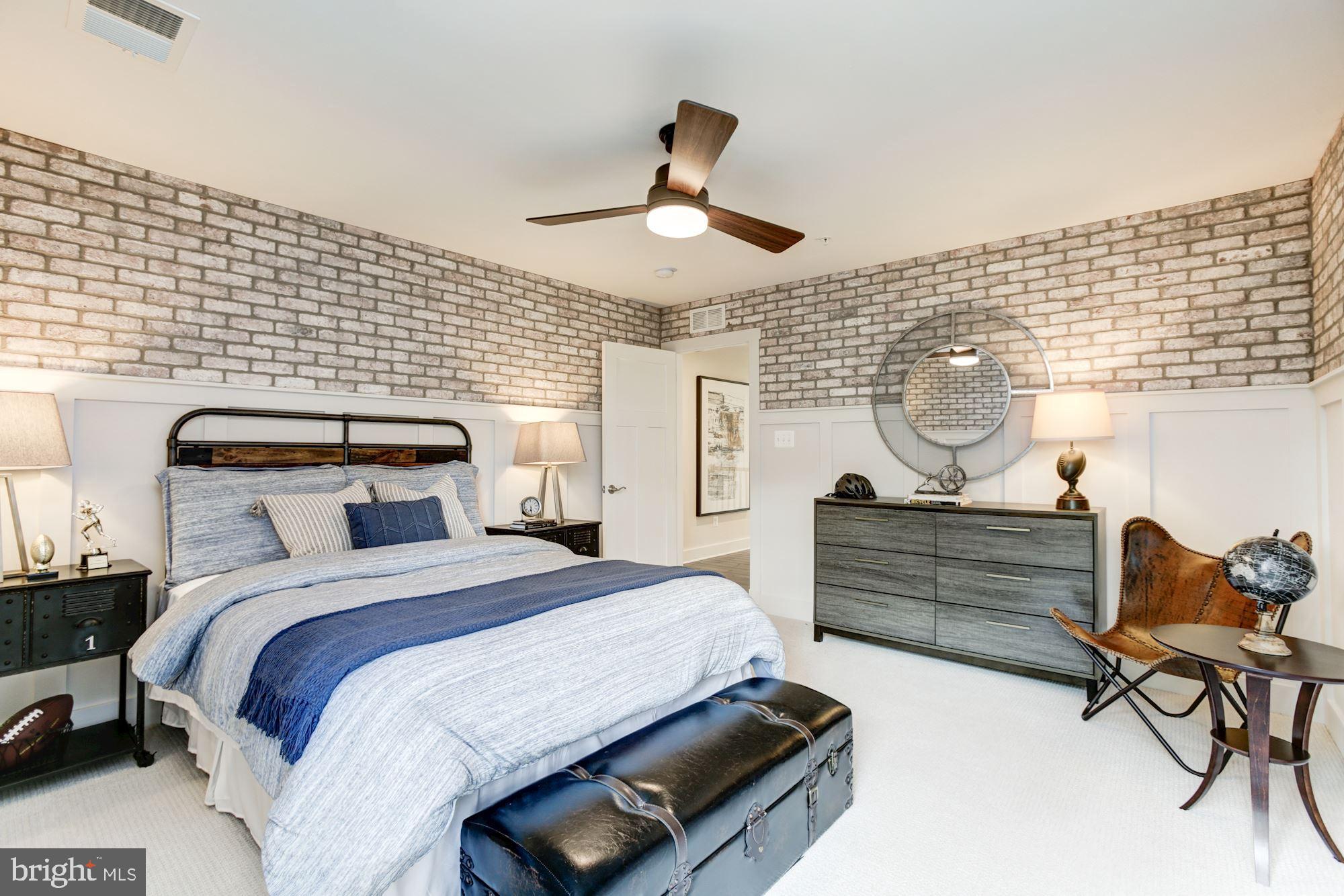 1713 Copperleaf Boulevard Hanover, MD 21076 - Photo 35 of 48 a bed room with a bed and a chandelier