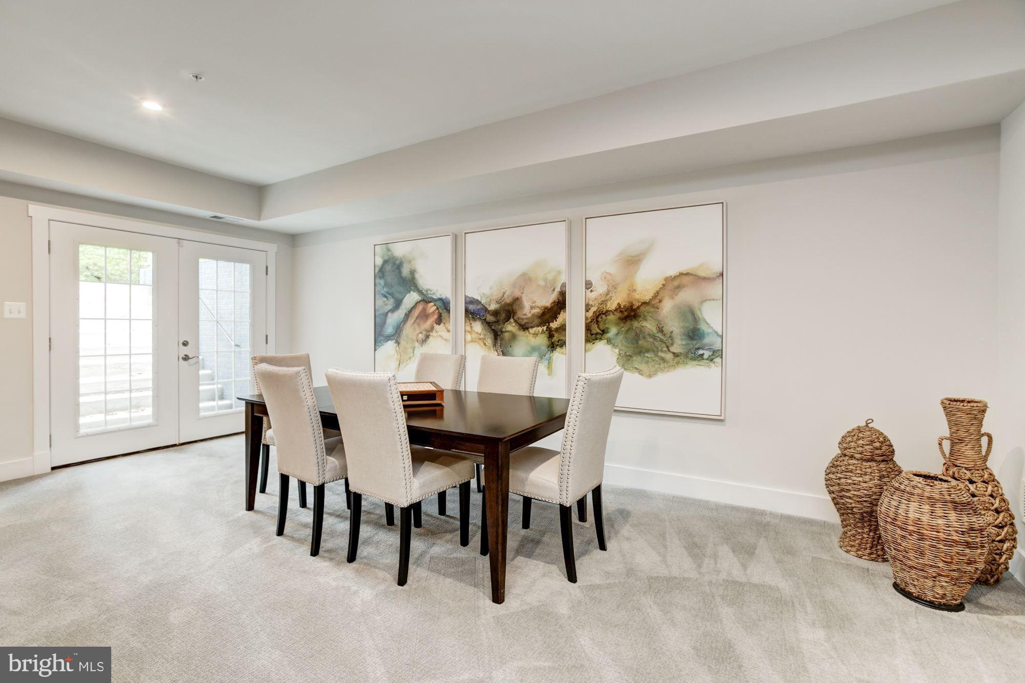 1713 Copperleaf Boulevard Hanover, MD 21076 - Photo 41 of 48 a view of a dining room with furniture and a large window