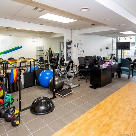 a view of living room with furniture and floor to ceiling window