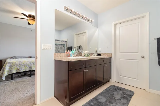 a en suite bathroom with a sink and a mirror