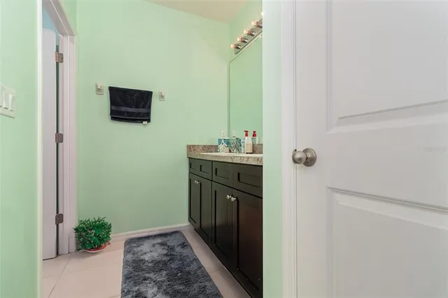 a bathroom with a sink a toilet and mirror
