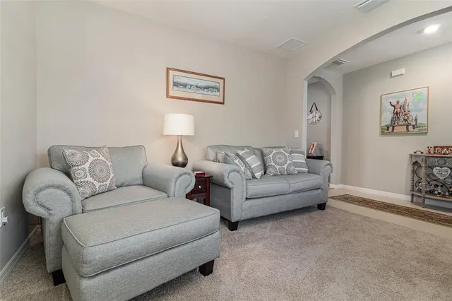 a living room with furniture and a couch