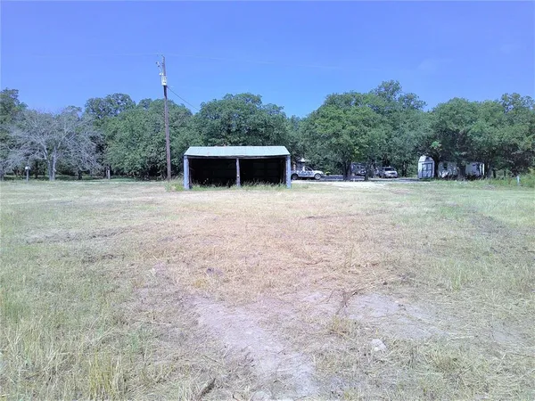 a big yard with trees