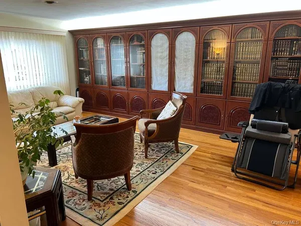 a living room with furniture fireplace and flat screen tv