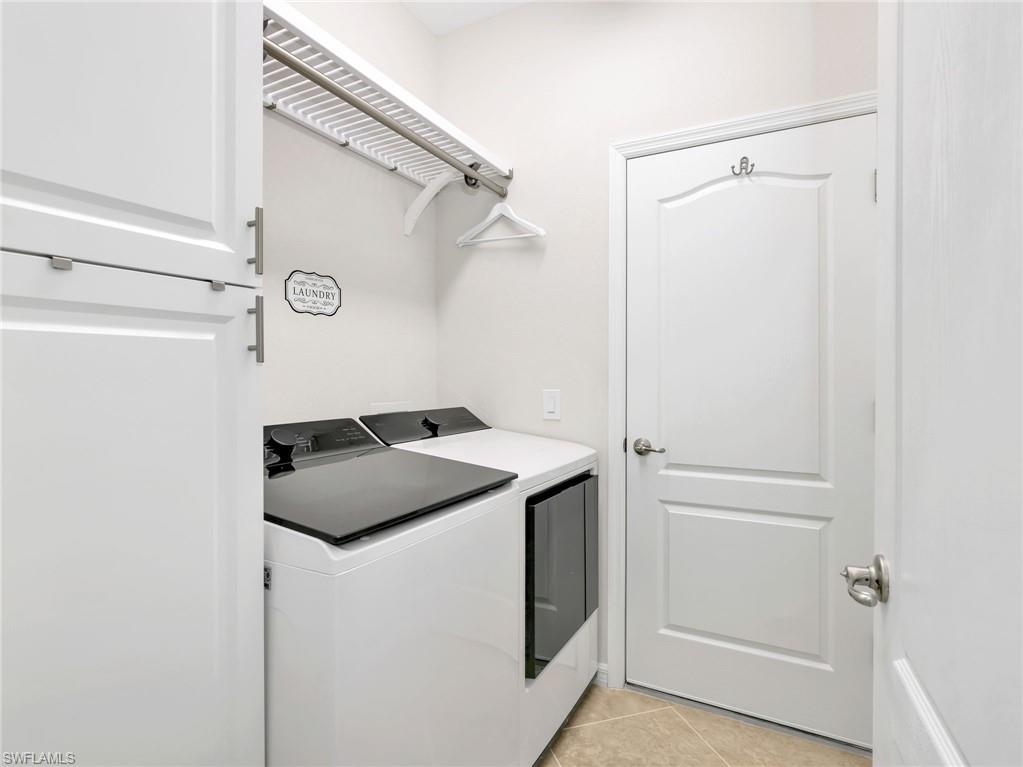 4383 Bismark Way Naples, FL 34119 - Photo 27 of 49 Laundry Room with Brand New LG Washer & Dryer, Hanging Rack with Shelf, & Tall Storage Closet