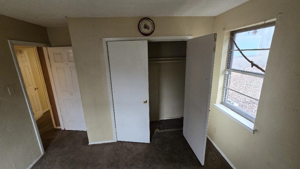 753 King Road Memphis, TN 38109 - Photo 5 of 17 a view of hallway with window and wooden floor
