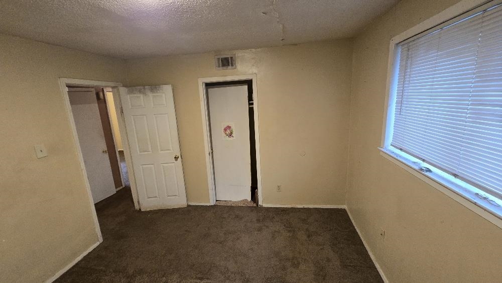 753 King Road Memphis, TN 38109 - Photo 7 of 17 an empty room that has a wooden door