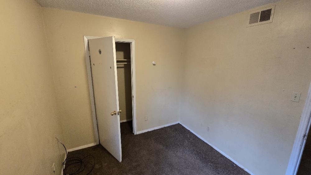 753 King Road Memphis, TN 38109 - Photo 10 of 17 an empty room with wooden door