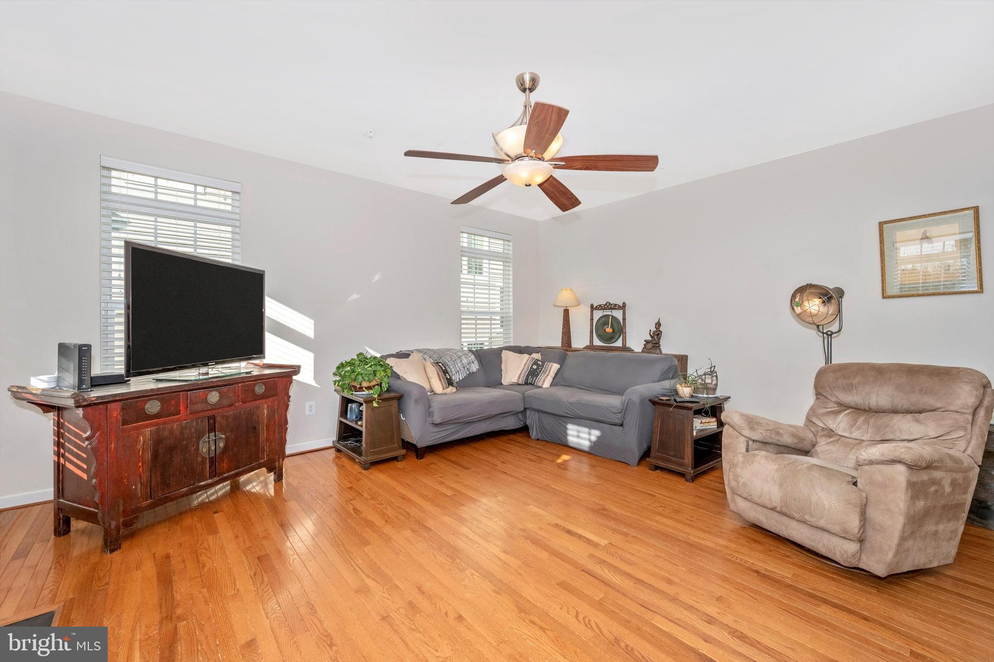 9121 Bealls Farm Road Frederick, MD 21704 - Photo 17 of 63 a living room with furniture and a flat screen tv