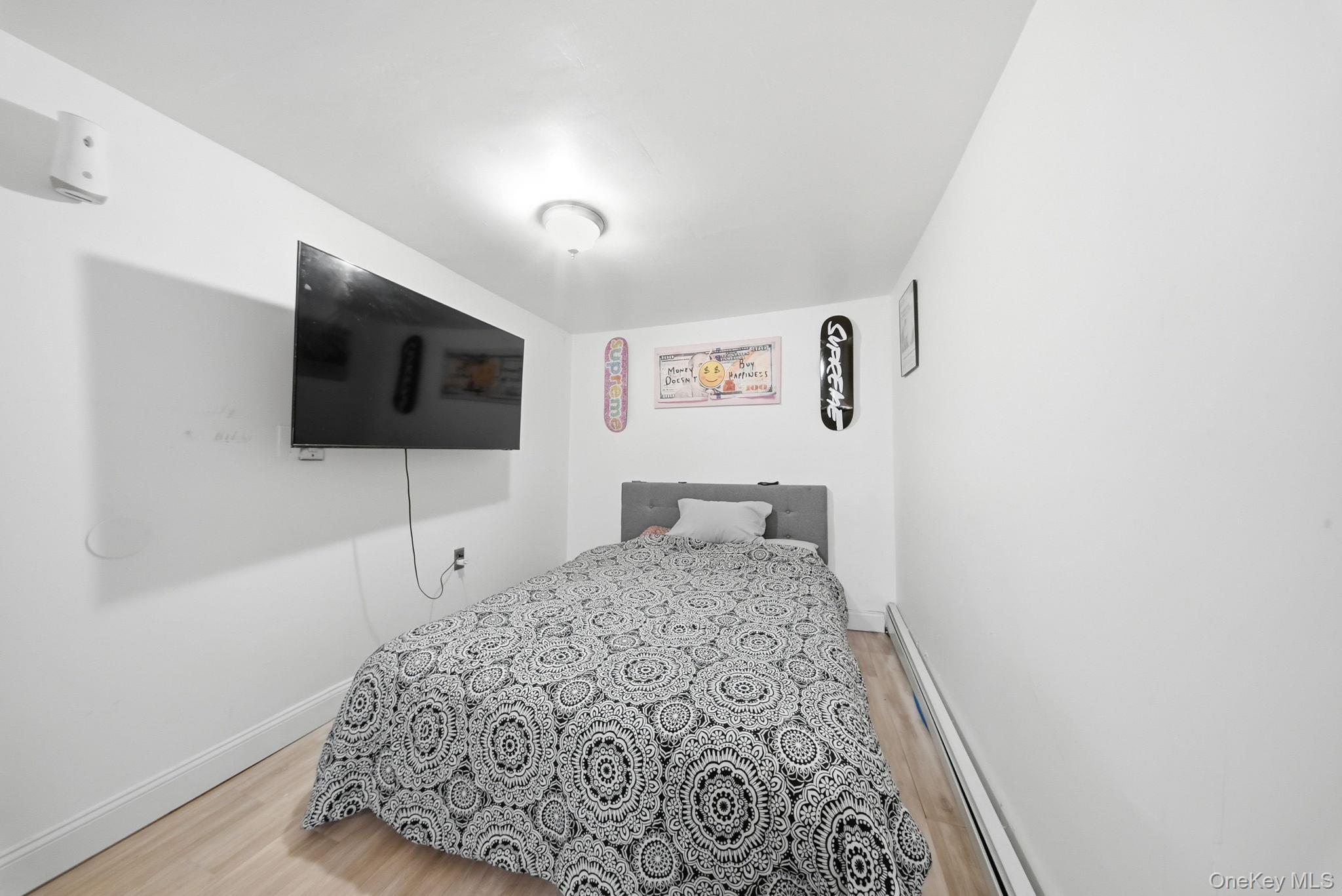 4 Old Road Cuddebackville, NY 12729 - Photo 13 of 16 a bedroom with a bed and a flat screen tv