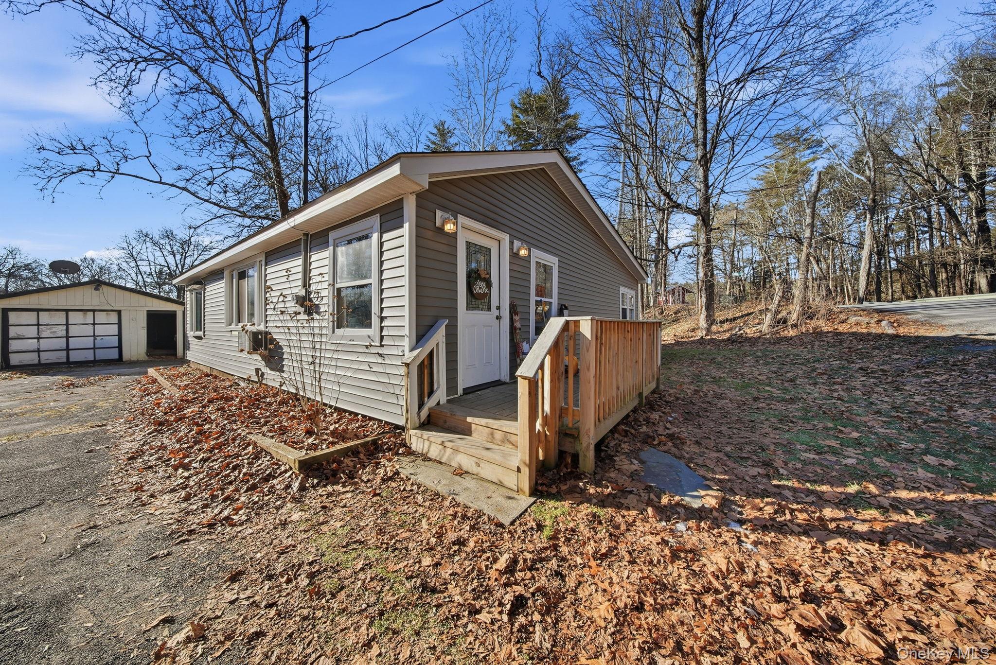 4 Old Road Cuddebackville, NY 12729 - Photo 2 of 16 a front view of a house with garden