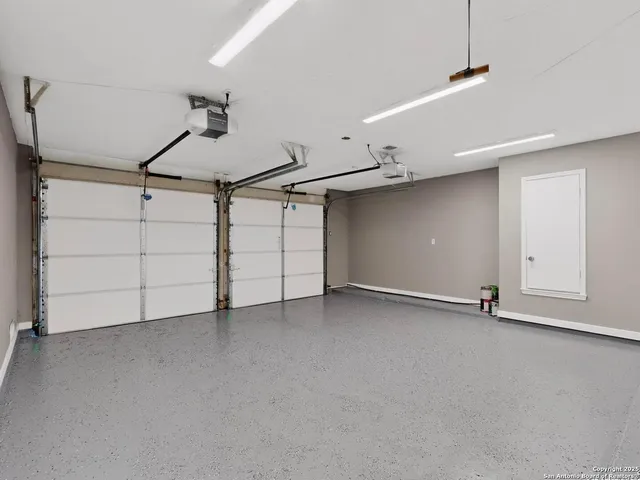 an empty room with a ceiling fan