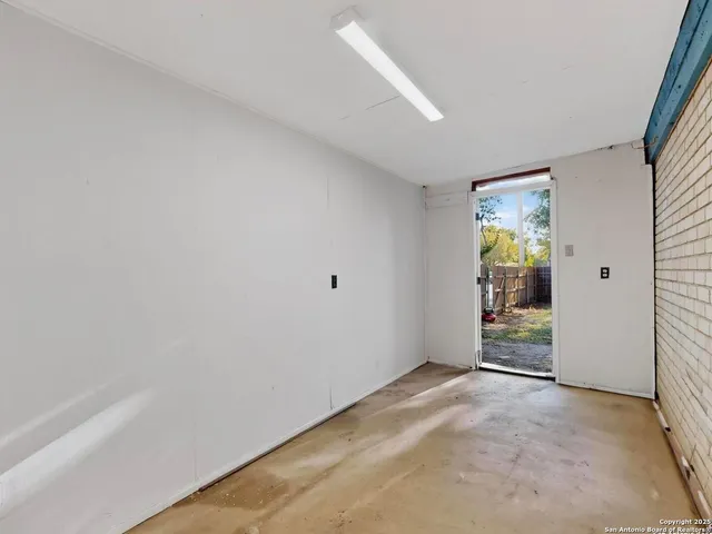 an empty room with windows