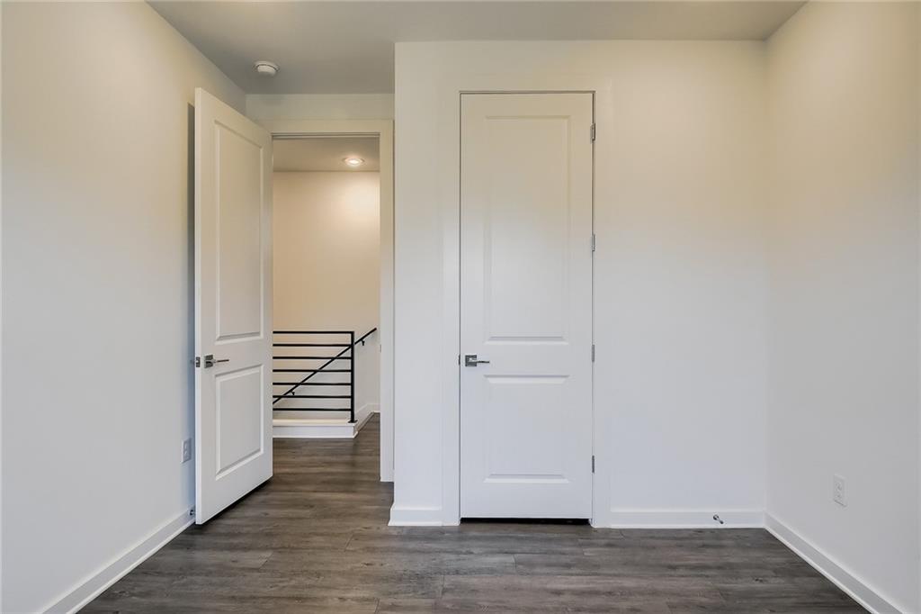 2624 Metcalfe Road, Unit 7 Austin, TX 78741 - Photo 22 of 31 a view of a hallway with wooden floor