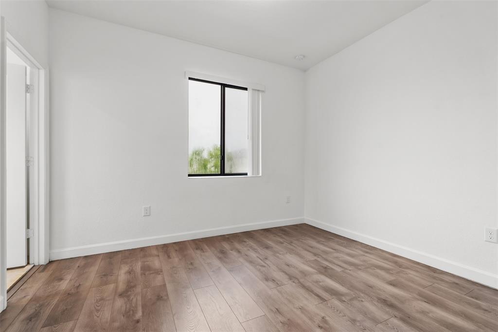 340 Northeast 208th Terrace, Unit 340 Miami, FL 33179 - Photo 11 of 38 an empty room with a window