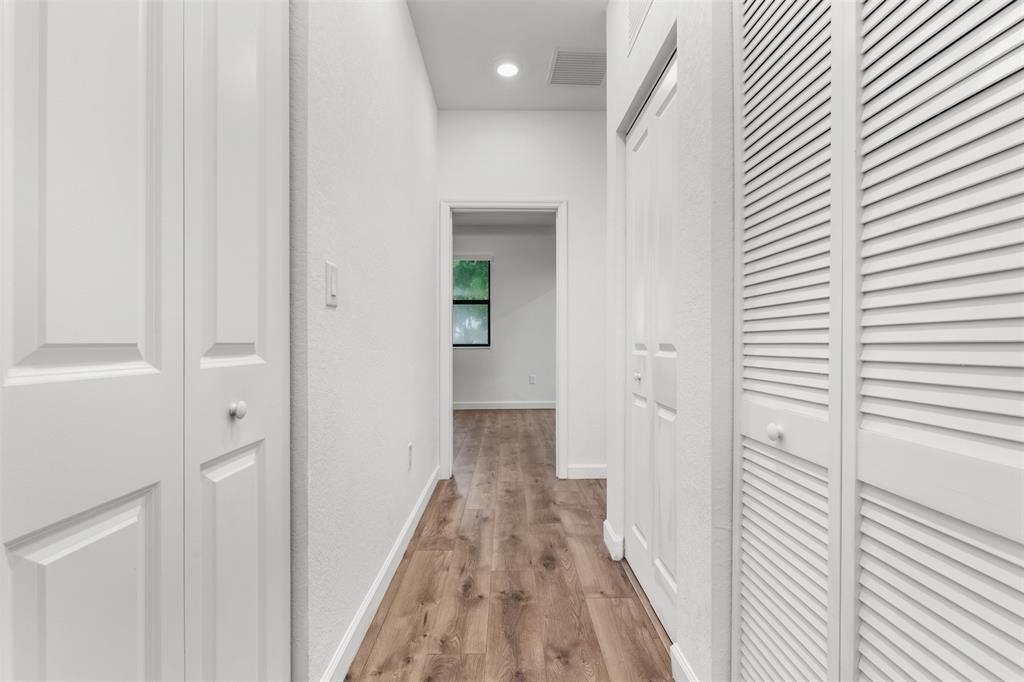 340 Northeast 208th Terrace, Unit 340 Miami, FL 33179 - Photo 12 of 38 a view of a hallway with wooden floor and staircase