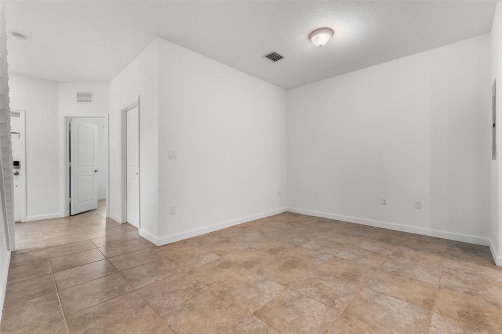 340 Northeast 208th Terrace, Unit 340 Miami, FL 33179 - Photo 21 of 38 an empty room with an entryway