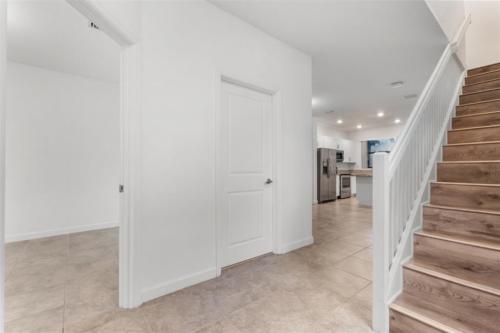 340 Northeast 208th Terrace, Unit 340 Miami, FL 33179 - Photo 29 of 38 a view of a hallway with stairs