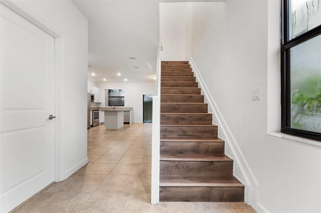 340 Northeast 208th Terrace, Unit 340 Miami, FL 33179 - Photo 30 of 38 a view of entryway and hall with wooden floor