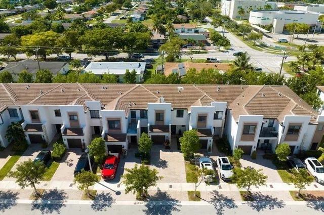 an aerial view of a house with outdoor space