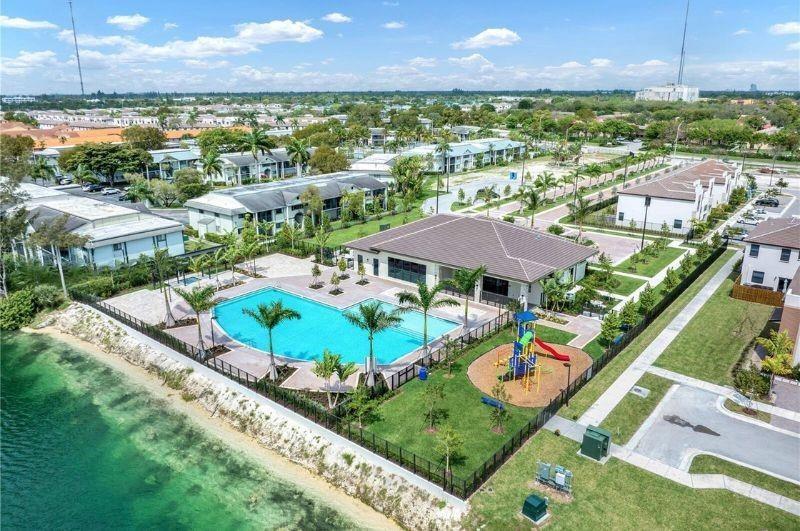 340 Northeast 208th Terrace, Unit 340 Miami, FL 33179 - Photo 37 of 38 an aerial view of residential houses with outdoor space and street view