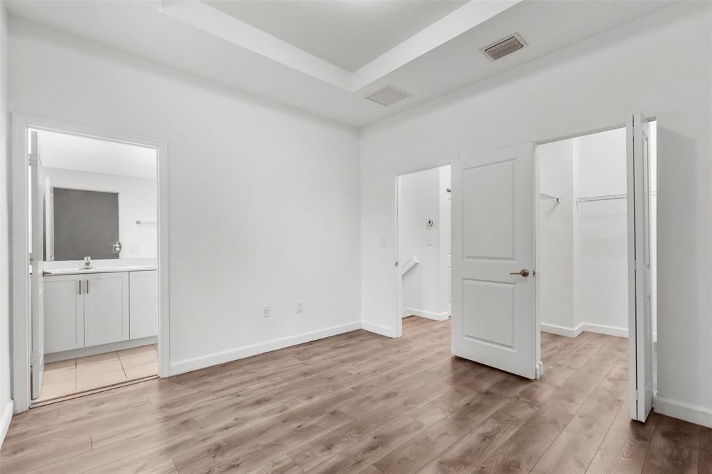 340 Northeast 208th Terrace, Unit 340 Miami, FL 33179 - Photo 7 of 38 wooden floor with white walls