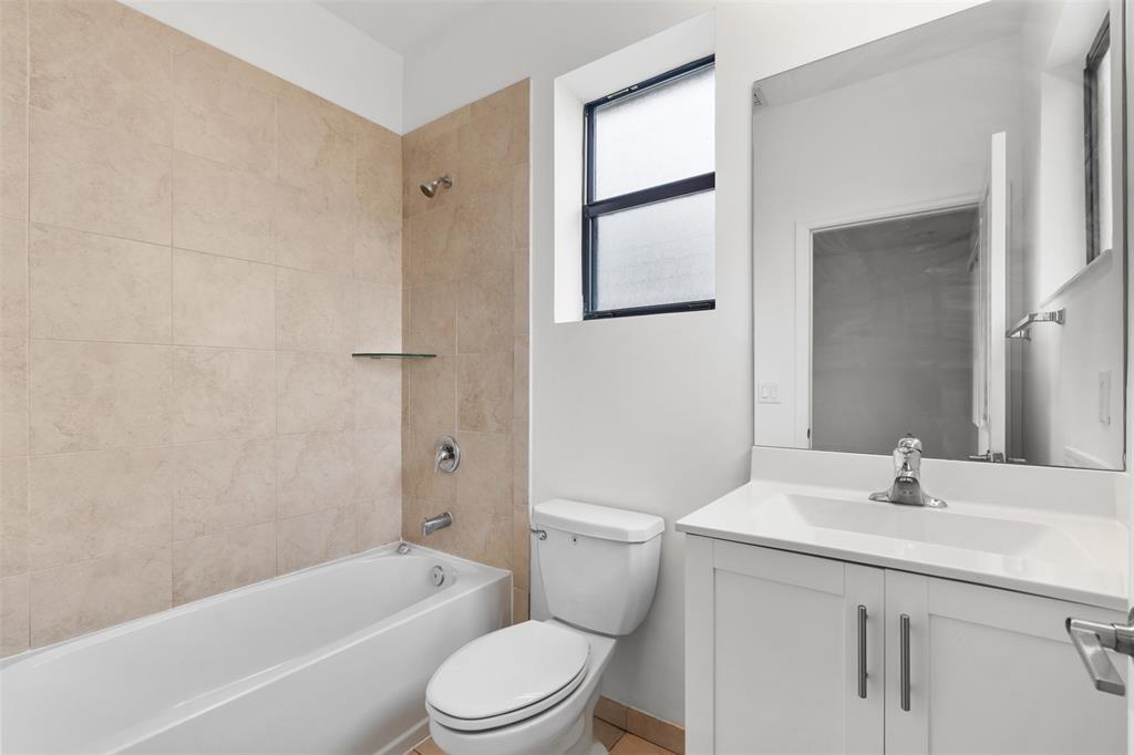 340 Northeast 208th Terrace, Unit 340 Miami, FL 33179 - Photo 9 of 38 a bathroom with a sink a toilet and shower