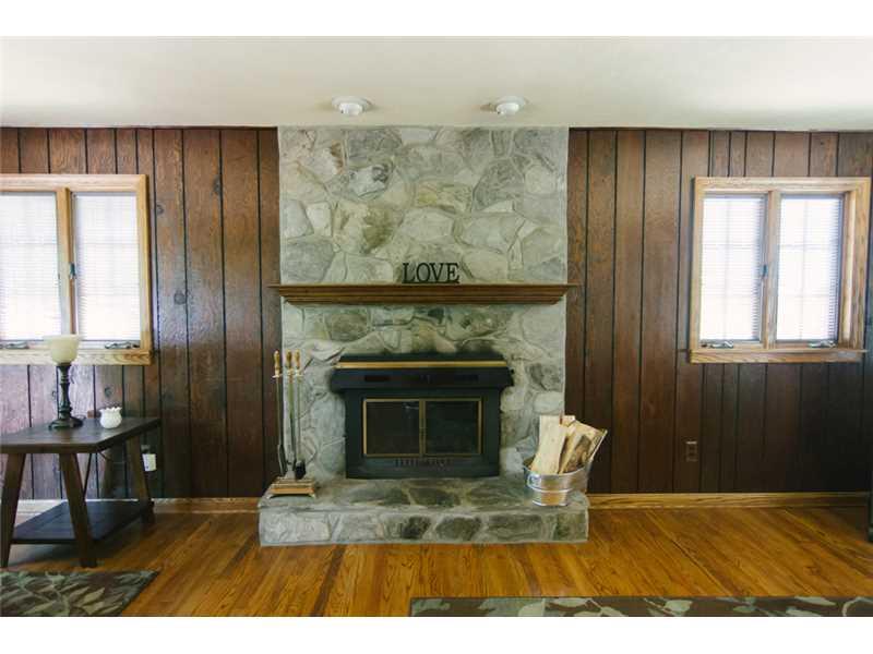 5211 Meadowcrest Road Baldwin, PA 15236 - Photo 9 of 25 Family Room. You will love the stone mantel fireplace warming the room.