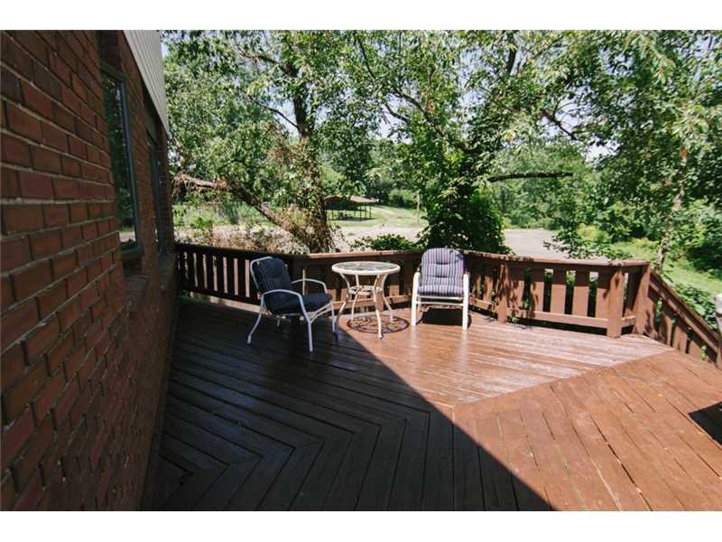 5211 Meadowcrest Road Baldwin, PA 15236 - Photo 10 of 25 Patio/Deck. Step right out from the family room and enjoy the view of your backyard.