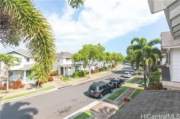 a view of a street with cars on both side