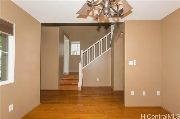 a view of entryway and hall with a front door