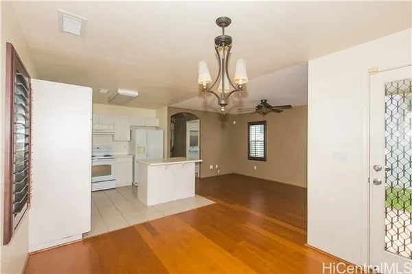 a view of a living room and kitchen