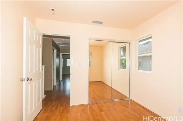 a view of a livingroom with wooden floor