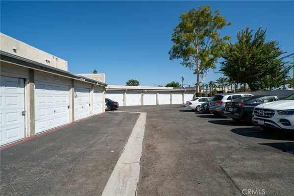 a view of a car park in front of house