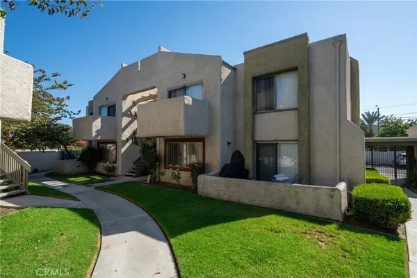 a view of a chair and table in the garden