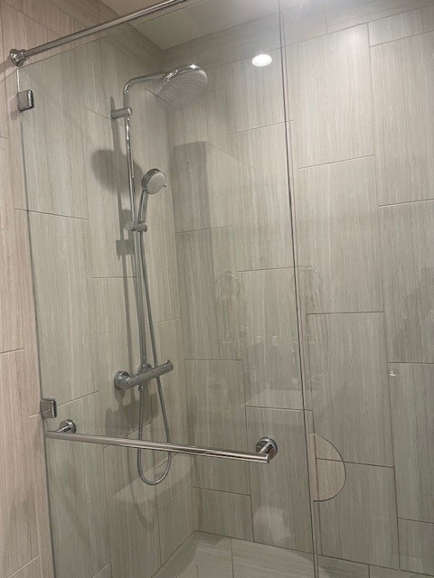 44 East Avenue, Unit 1210 Austin, TX 78701 - Photo 12 of 12 a bathroom with a shower and a sink