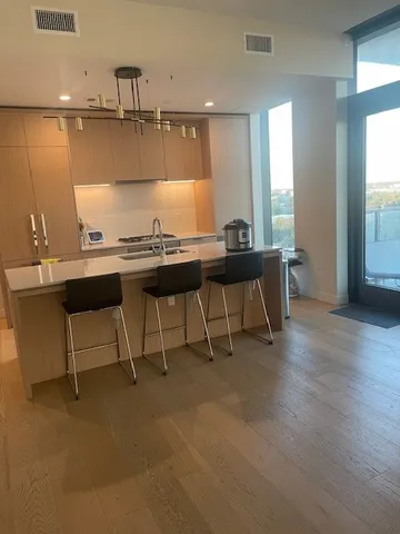 a living room with furniture a window and a table