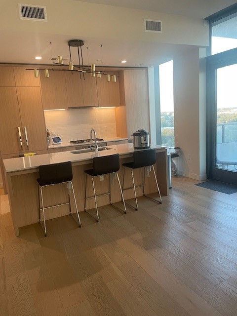 44 East Avenue, Unit 1210 Austin, TX 78701 - Photo 3 of 12 a living room with furniture a window and a table