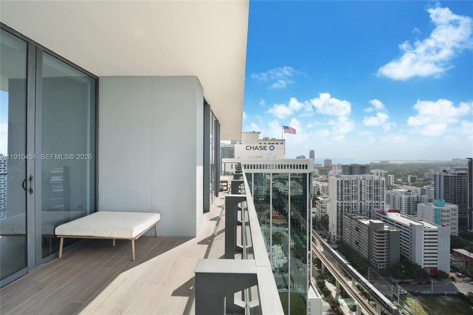 88 Southwest 7th Street, Unit 2602 Miami, FL 33130 - Photo 22 of 28 a view of a balcony with chairs
