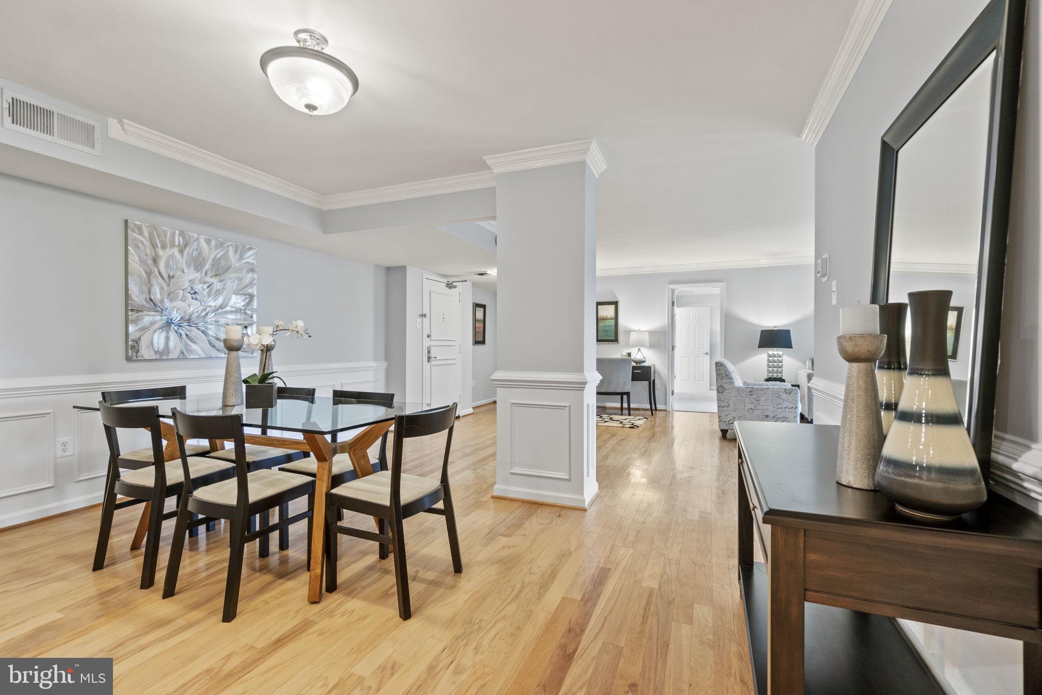 1515 South Arlington Ridge Road, Unit 603 Arlington, VA 22202 - Photo 7 of 22 a dining room with furniture and wooden floor