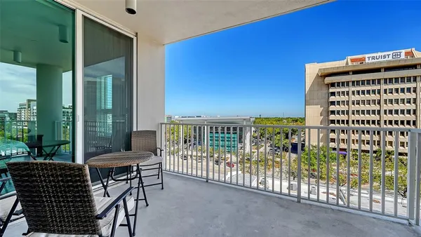 a view of a balcony with chairs