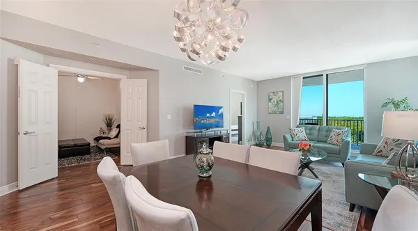 a dining room with furniture and window