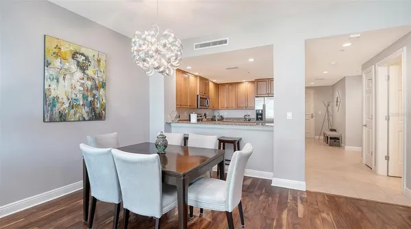 a kitchen with stainless steel appliances granite countertop a sink refrigerator and cabinets
