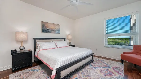 a bedroom with a bed and glass window