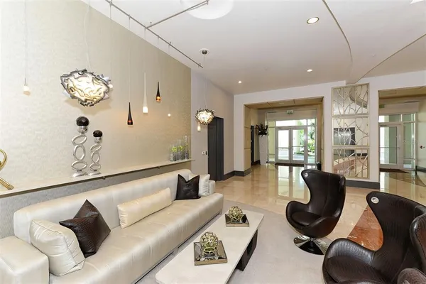 a living room with furniture and window