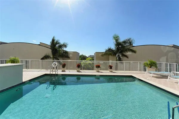 a view of a house with a backyard porch and sitting area