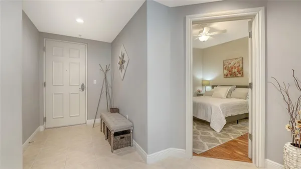 a living room with furniture a couch and a flat screen tv