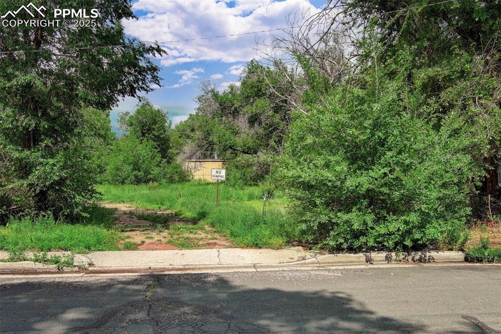 508 Sunset Road Colorado Springs, CO 80909 - Photo 2 of 11 a view of a entrance gate of a house