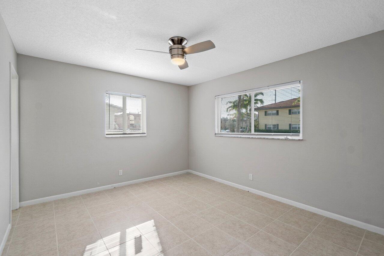 209 Southwest 6th Street, Unit 209 Boca Raton, FL 33432 - Photo 17 of 37 a view of empty room with window