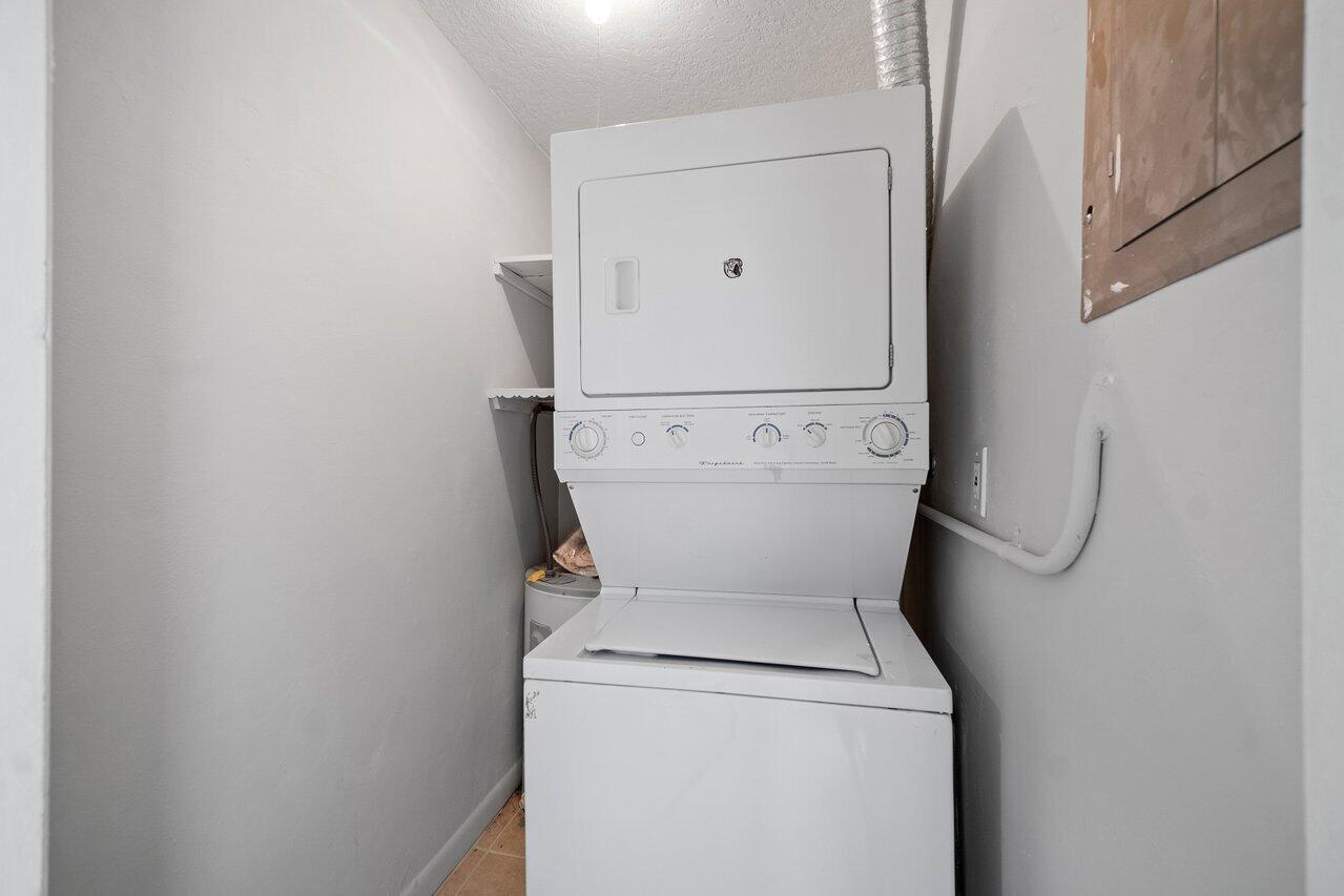 209 Southwest 6th Street, Unit 209 Boca Raton, FL 33432 - Photo 23 of 37 a utility room with dryer and washer